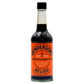 A 284ml bottle of Henderson’s - Strong & Northe Relish, featuring a black cap and an orange label with the brand name and details, is known for its tangy flavor and versatility.